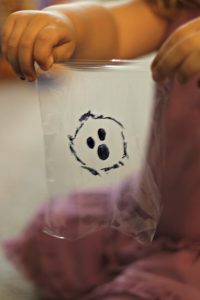 Boo face on clear plastic wrap - happily ever mom