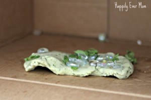 lemon herb play dough in the cardboard oven