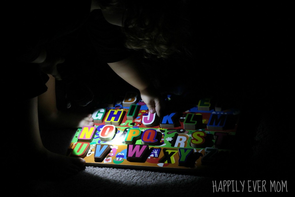 Flashlight Alphabet Game putting back the letter J from Happilyevermom