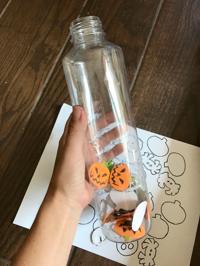 Fun Halloween Activity for toddlers and preschoolers. Just need a few Halloween stickers and an empty bottle - great activity for when your traveling or if you need a few minutes to cook dinner! Love how easy (and inexpensive!) it is to do this activity with my kids.